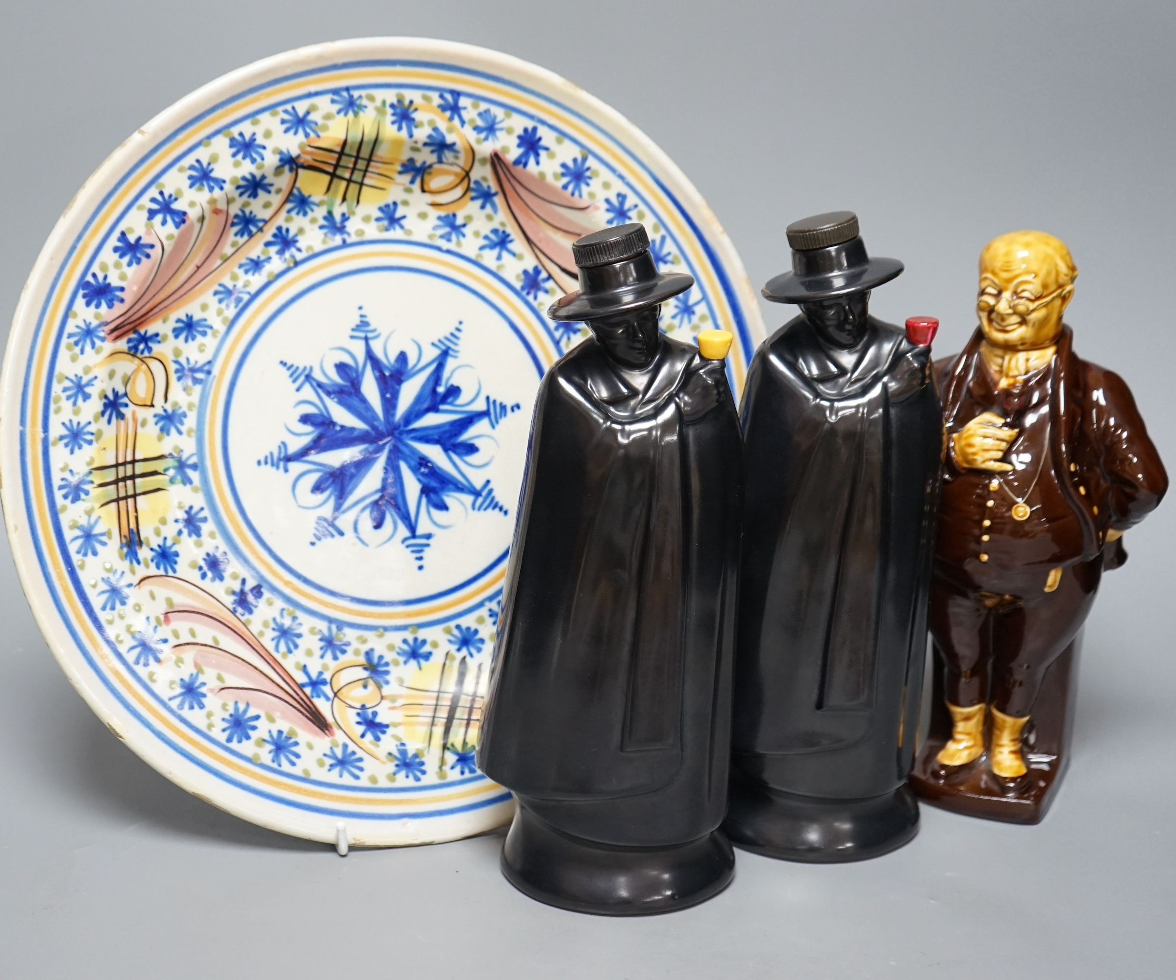 Two Doulton Sandeman bottles, a Dicken’s character bottle, and a Spanish maiolica dish, Sandeman bottles 27cms high